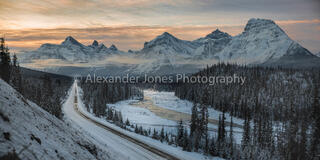 Panoramic of a mountain range during sunrise in Jasper National Park in the Canadian Rocky Mountains