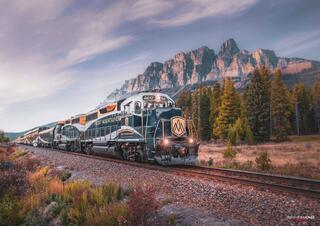 the rocky mountaineer going past castle mountain in banff national park