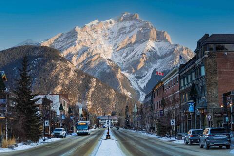 Banff Avenue during sunrise, cascade mountain behind town