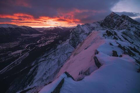 a winter sunrise at ha-lin peak in canmore