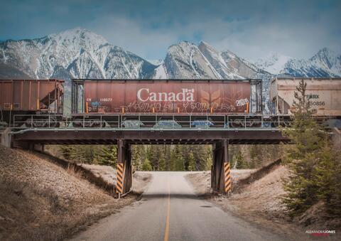 Canadian freight train with mountains in the background in the canadian rocky mountains in jasper national park