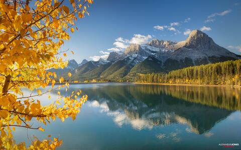 fall trees and ha-ling peak with mirror reflection on rundle forebay.