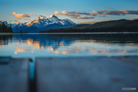 Sunrise over mountain lake at Maligne Lake in Jasper National Park in the Canadian Rocky Mountains