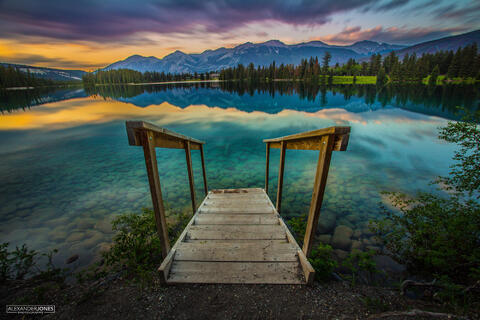 Colorful Rainbow sunset over Lac Beauvert in Jasper National Park in Canadian Rocky Mountains