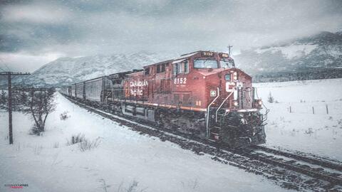 a cp freight train during a snowstorm