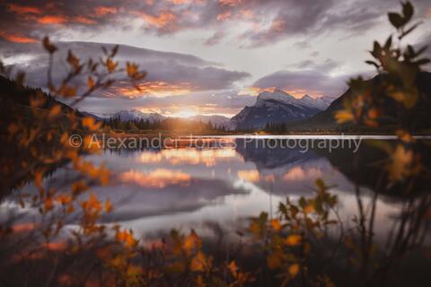 A sunrise at Vermillion Lakes in Banff during fall with Mt. Rundle reflecting on the water