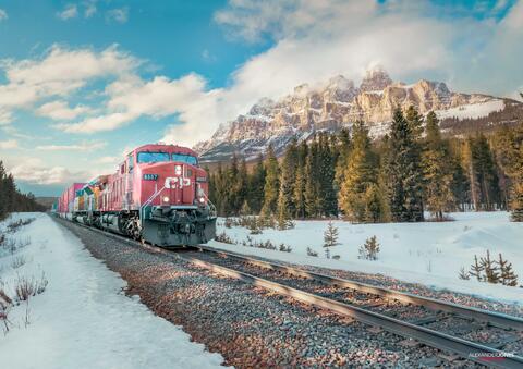 a CP train going past castle mountain in banff national park