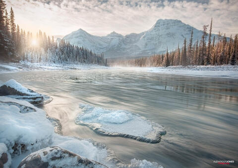 An iceberg on a river on a winter morning during sunrise in canadian rocky mountains Jasper National Park