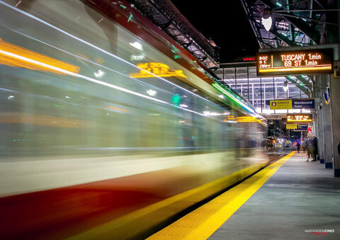Long exposure image of a calgary metro train entering station in the city of calgary in Canada