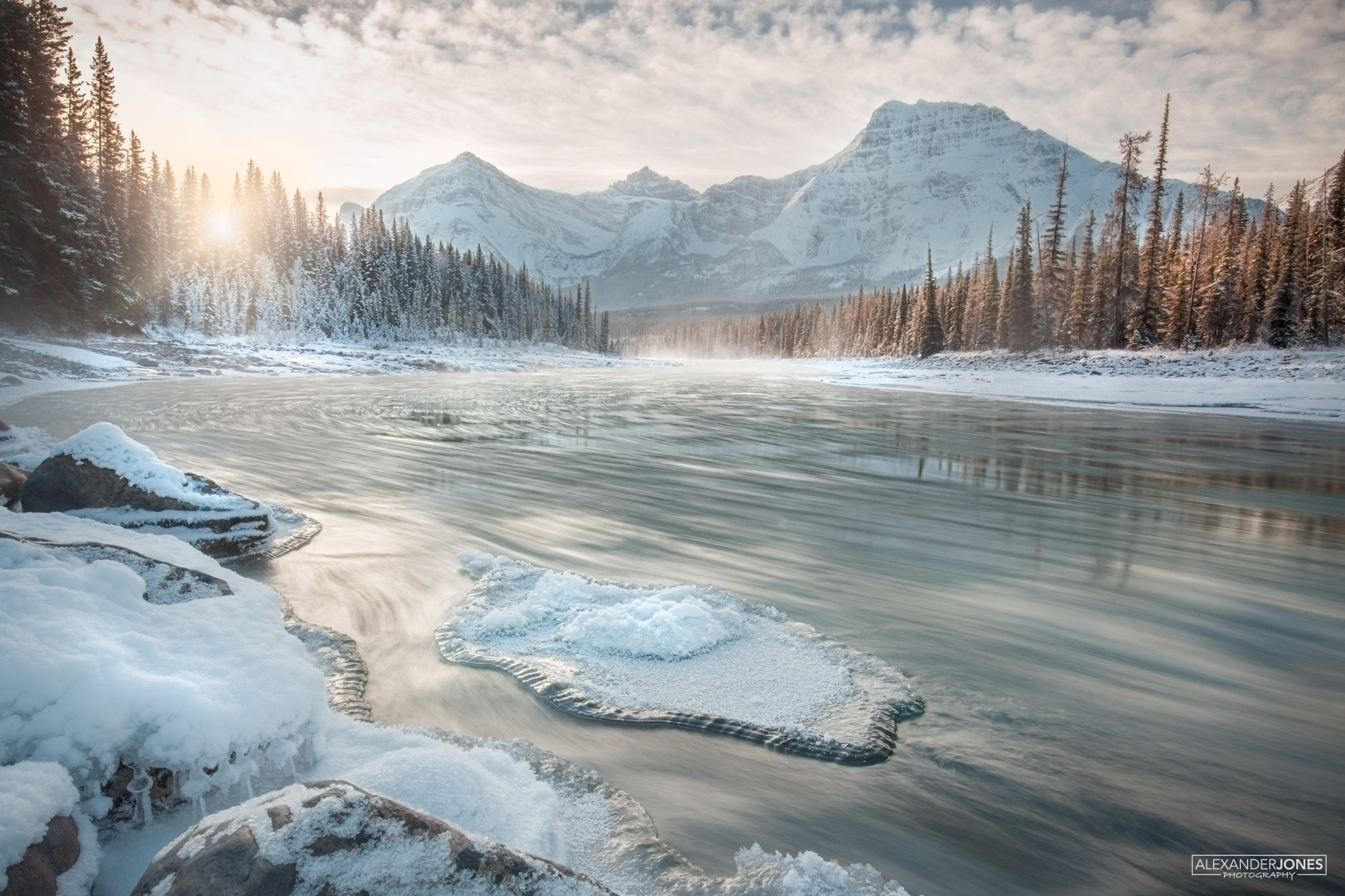 Haze Icefields Parkway An iceberg on a river on a winter morning during sunrise in canadian rocky mountains Jasper National Park
