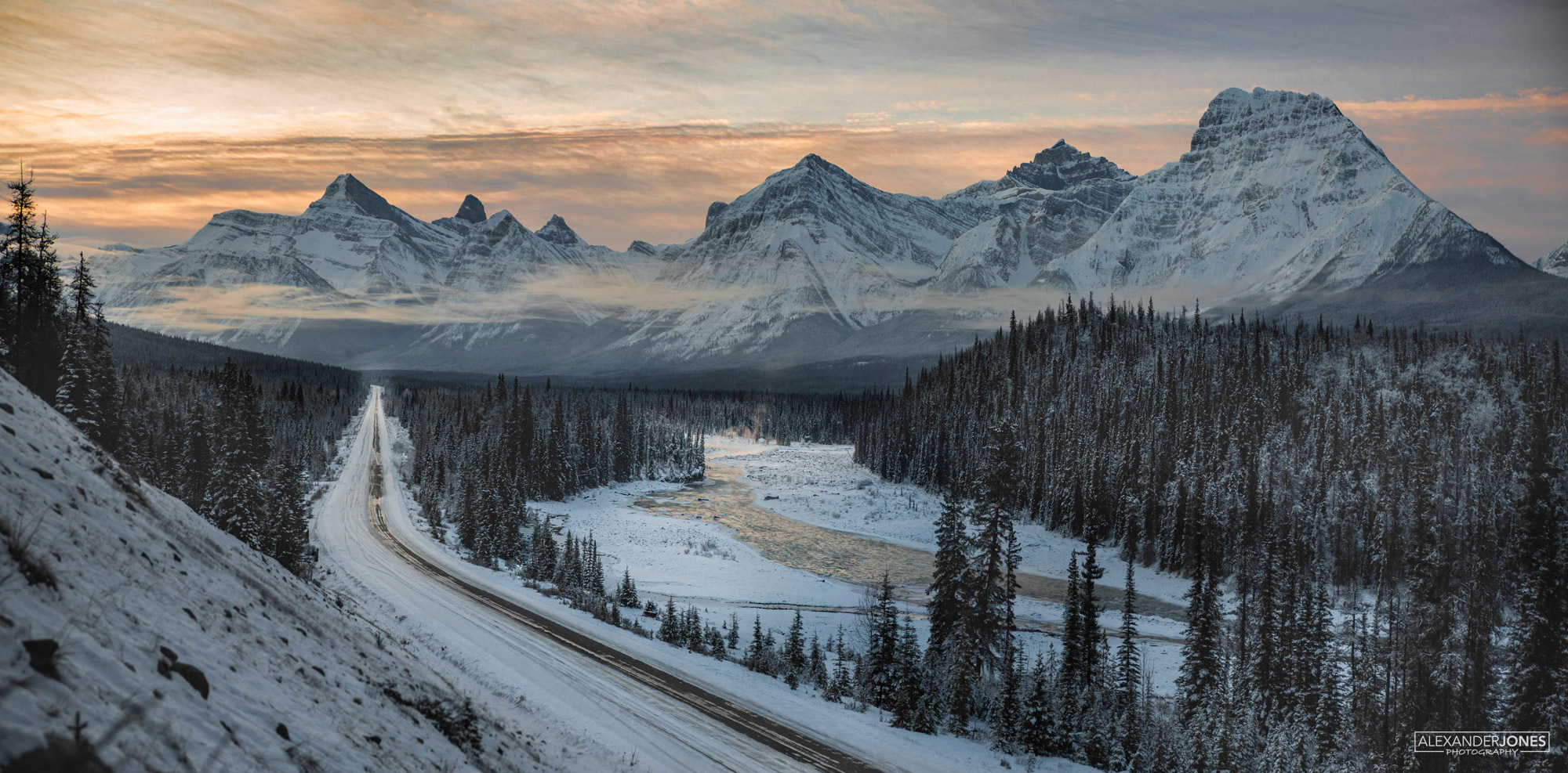 Panoramic of a mountain range during sunrise in Jasper National Park in the Canadian Rocky Mountains