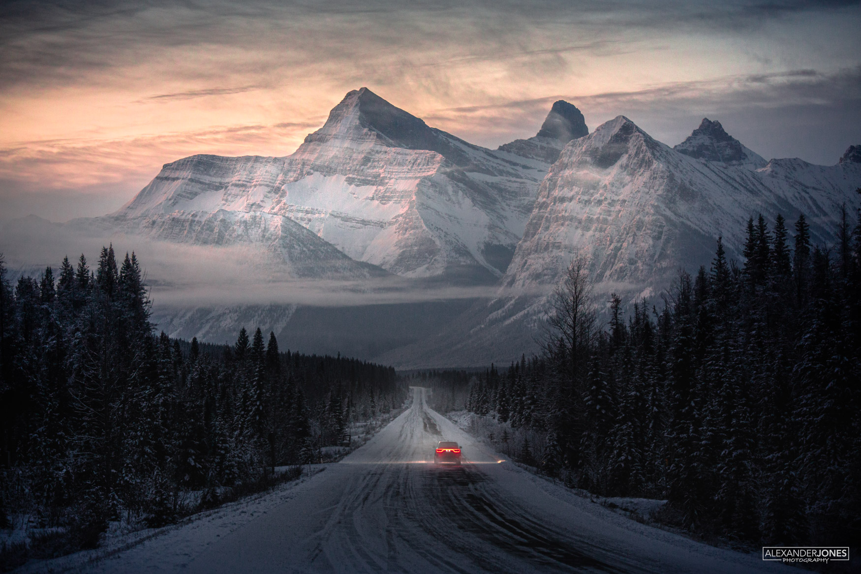 Mountain Dreams, Icefelds Parkway Car driving through canadian rocky mountains during sunrise in winter